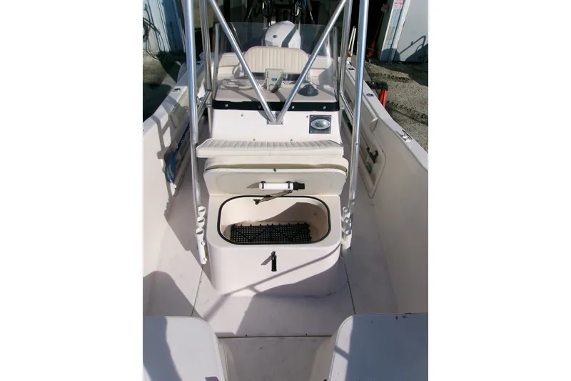 Slide: The Image of 2000 Grady-White Escape 209 boat interior with seating and storage compartments. - 40