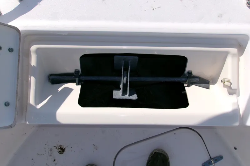 Slide: The Image of Anchor storage compartment on a 2000 Grady-White Escape 209 boat. - 44