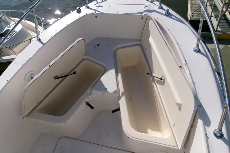 Slide: The Image of Open storage compartments on a 2000 Grady-White Escape 209 boat deck. - 37