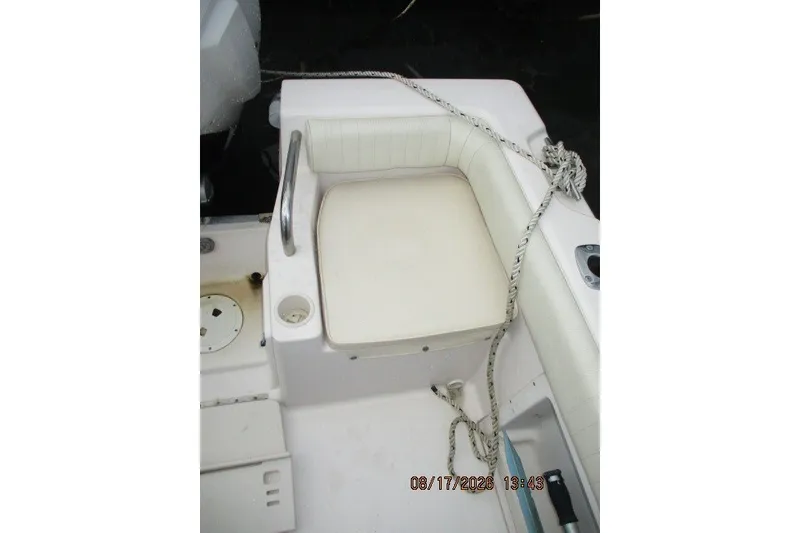 Slide: The Image of 2000 Grady-White Escape 209 boat seat with rope and cup holder. - 35