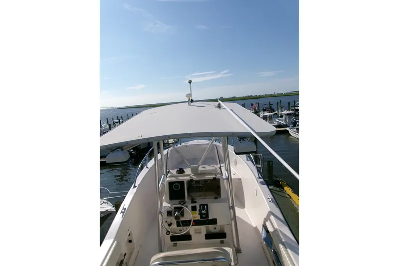 Slide: The Image of 2000 Grady-White Escape 209 boat docked at marina under clear blue sky. - 46