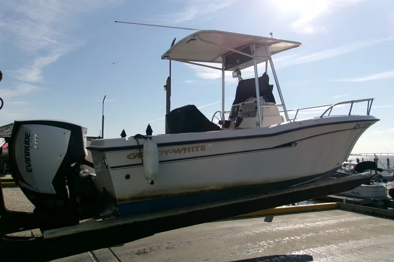 Slide: The Image of 2000 Grady-White Escape 209 boat with Evinrude engine on trailer. - 24