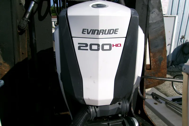 Slide: The Image of Evinrude 200 HP outboard motor on a 2000 Grady-White Escape 209 boat. - 47