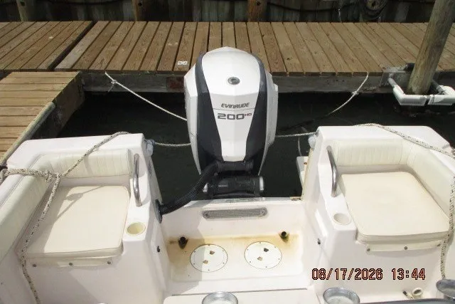 Slide: The Image of 2000 Grady-White Escape 209 boat with Evinrude 200 HP engine at dock. - 31