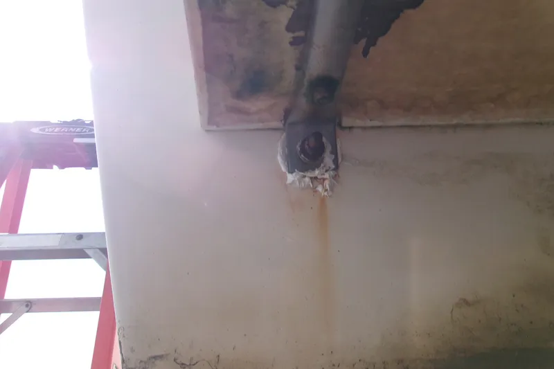 Slide: The Image of Close-up of a Grady-White Escape 209 boat's underside, showing a corroded bolt. - 10