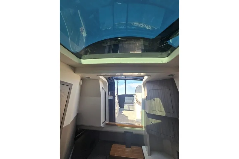 Slide: The Image of Interior view of 2024 Sea Ray Sundancer 370 Outboard with skylight and open cabin door. - 19