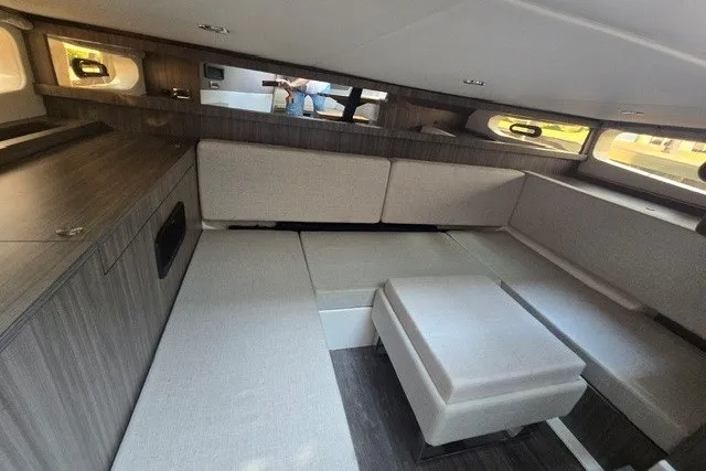 Slide: The Image of Interior of 2024 Sea Ray Sundancer 370 Outboard, featuring modern seating and sleek design. - 16