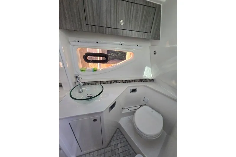 Slide: The Image of Luxurious bathroom interior of 2024 Sea Ray Sundancer 370 Outboard yacht, featuring modern fixtures. - 18