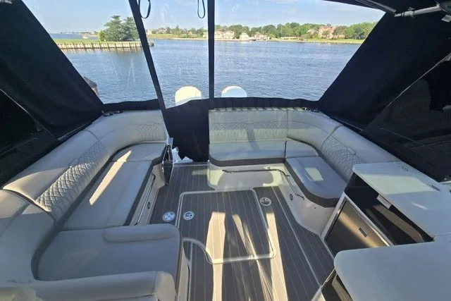 Slide: The Image of Luxurious 2024 Sea Ray Sundancer 370 Outboard interior with waterfront view. - 13