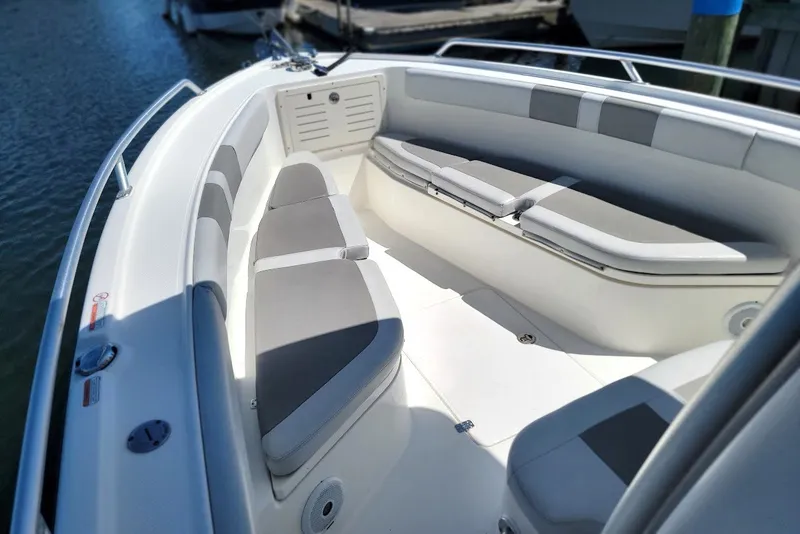Slide: The Image of 2018 Mako 284 Center Console boat interior with cushioned seating and sleek design. - 23