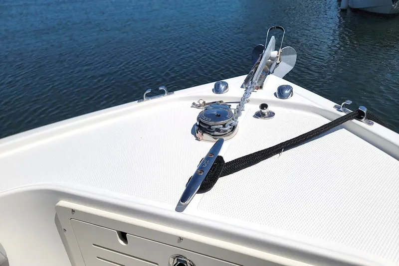 Slide: The Image of Bow of 2018 Mako 284 Center Console boat with anchor and cleat. - 24