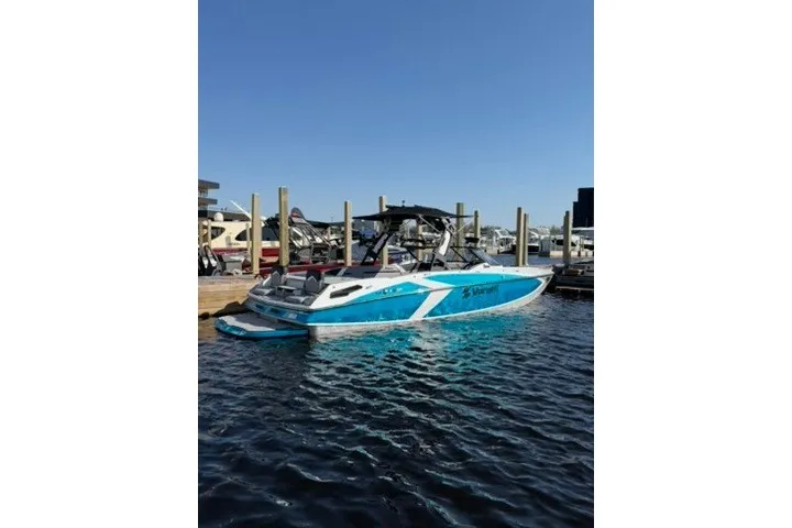 Slide: The Image of 2026 Varatti Z2373 boat docked on calm water under clear blue sky. - 1