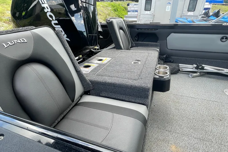 Slide: The Image of Interior of 2023 Lund 1975 Tyee boat with seating and storage compartments. - 6