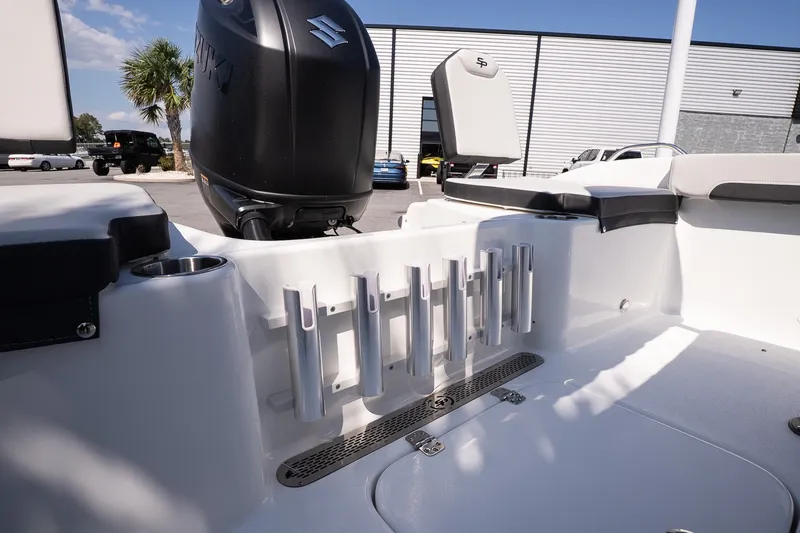 Slide: The Image of 2027 Sea Pro 202 Center Console boat interior with Suzuki engine and rod holders. - 18
