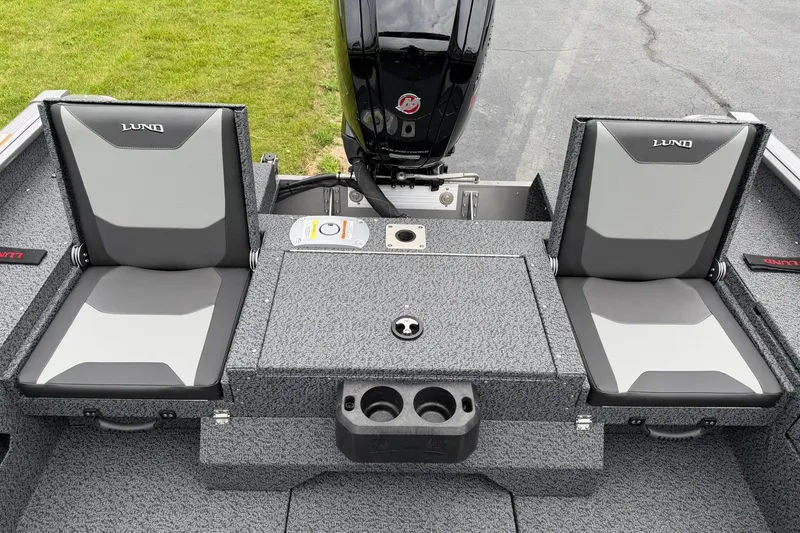 Slide: The Image of 2027 Lund 1775 Impact XS Sport boat seats and motor, featuring gray upholstery. - 9