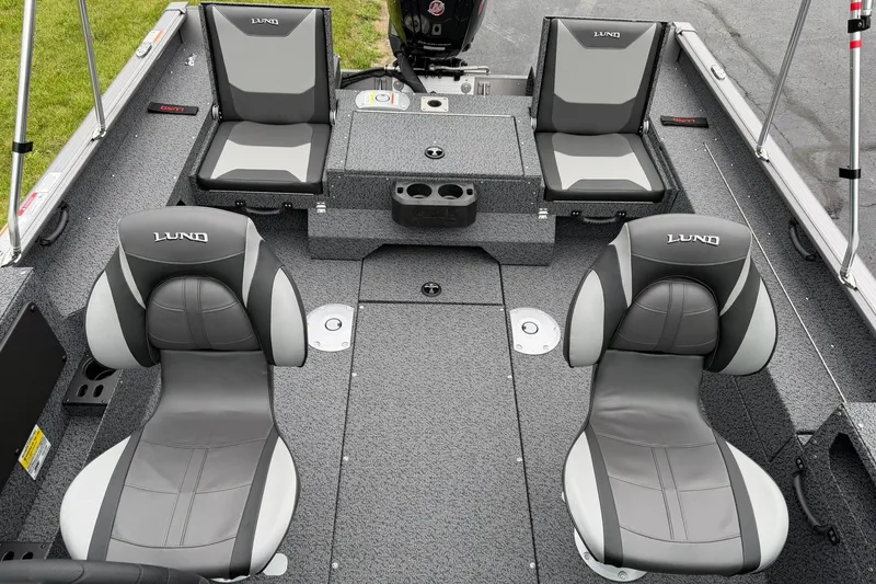 Slide: The Image of 2027 Lund 1775 Impact XS Sport boat interior with gray seating and modern design. - 8