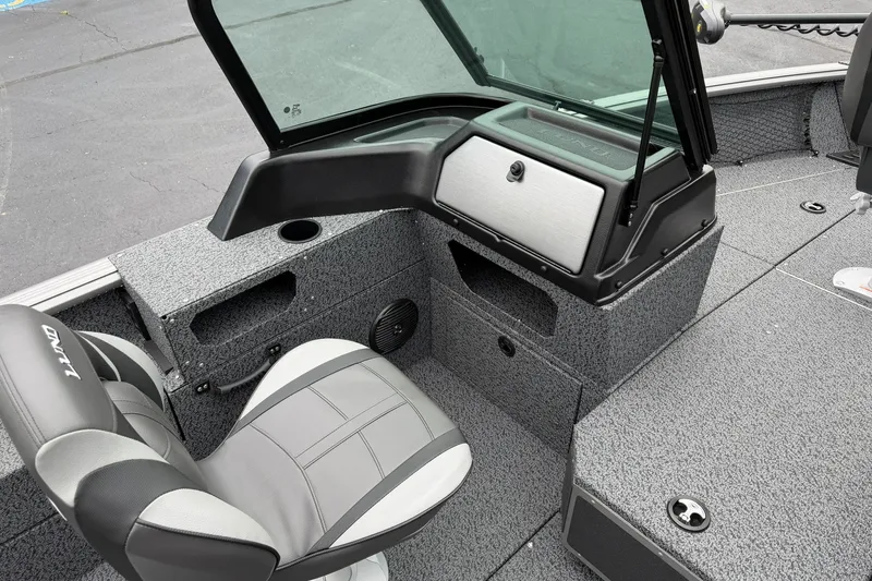 Slide: The Image of 2027 Lund 1775 Impact XS Sport boat interior with seating and storage compartments. - 13
