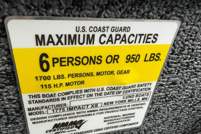 Slide: The Image of U.S. Coast Guard capacity label for Lund 1775 Impact XS Sport, 2027 model. - 26