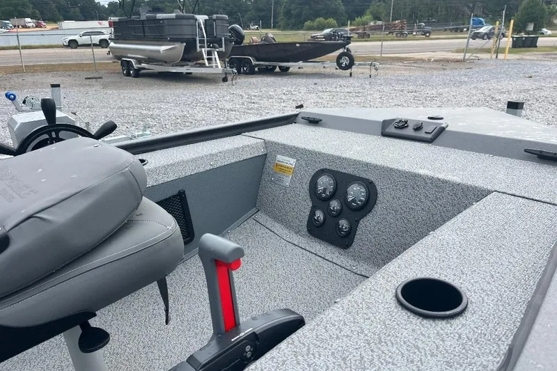 Slide: The Image of 2027 War Eagle 754VS Stick Steer boat interior with steering console and gauges. - 3