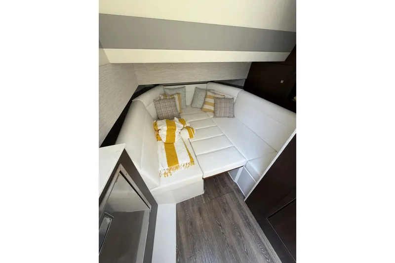 Slide: The Image of Luxurious interior of 2024 Cruisers Yachts 42 GLS OB with cozy seating and stylish decor. - 20