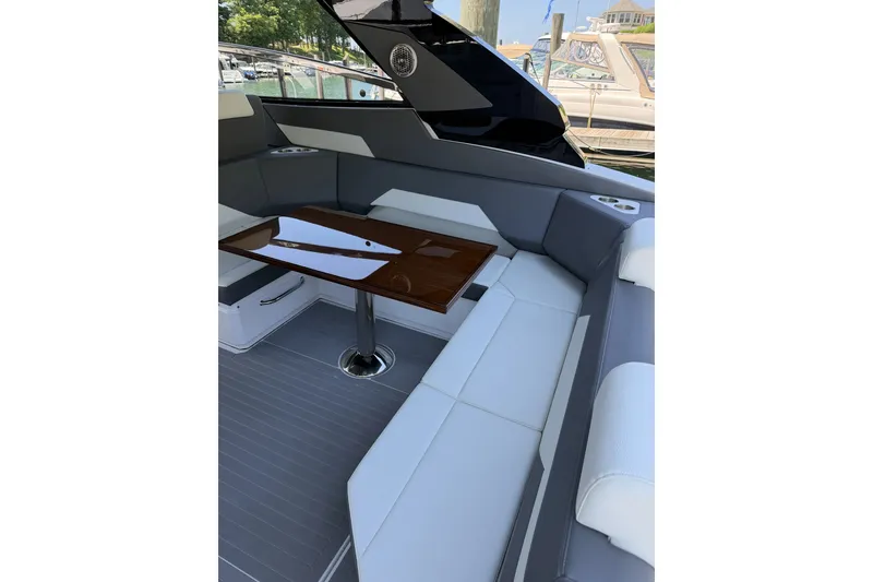 Slide: The Image of Luxurious seating area on 2024 Cruisers Yachts 42 GLS OB with sleek table design. - 8