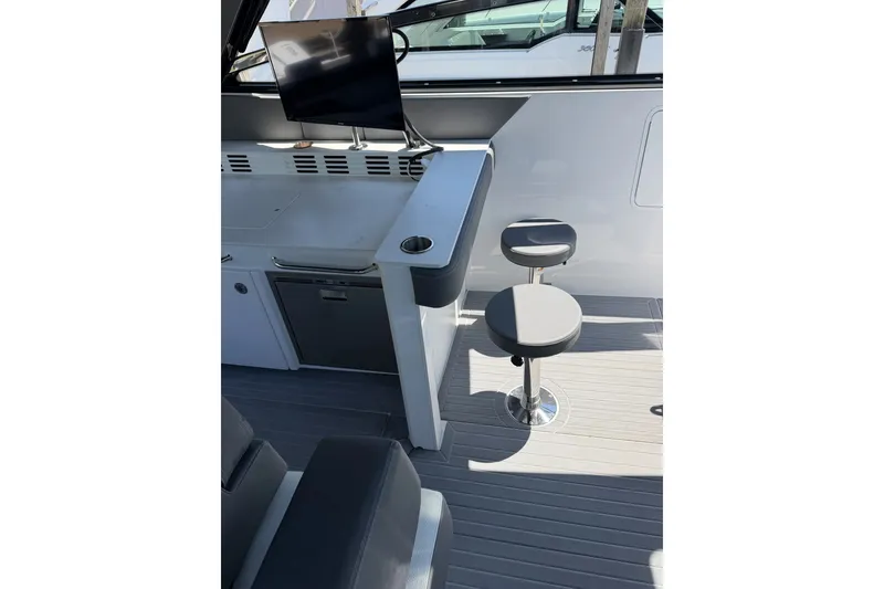 Slide: The Image of 2024 Cruisers Yachts 42 GLS OB interior with seating and entertainment area. - 10
