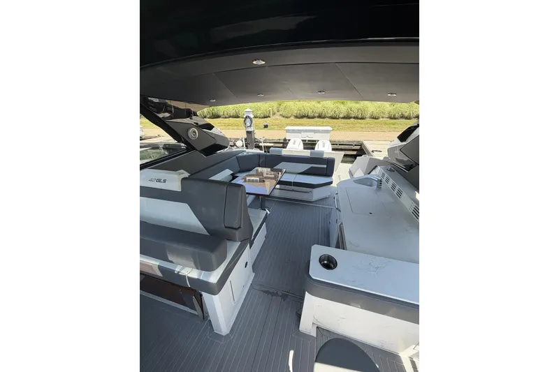 Slide: The Image of 2024 Cruisers Yachts 42 GLS OB interior with sleek seating and modern design. - 9