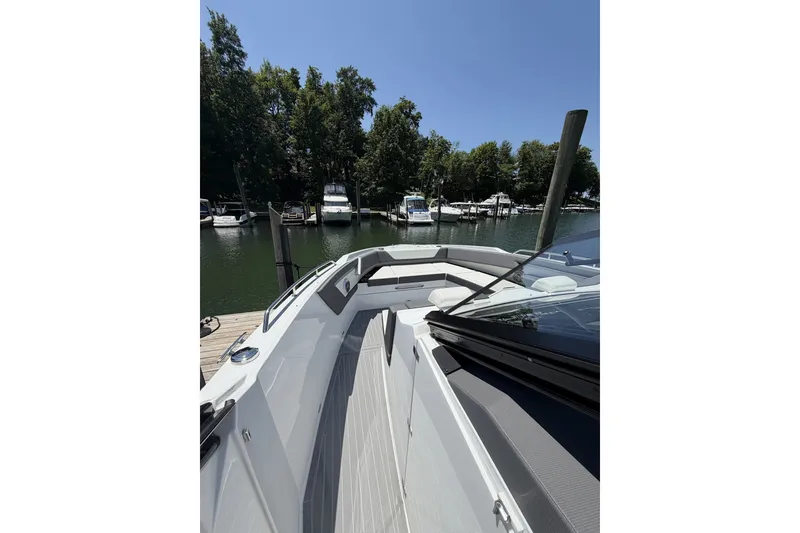 Slide: The Image of 2024 Cruisers Yachts 42 GLS OB docked, showcasing sleek design and spacious deck. - 16