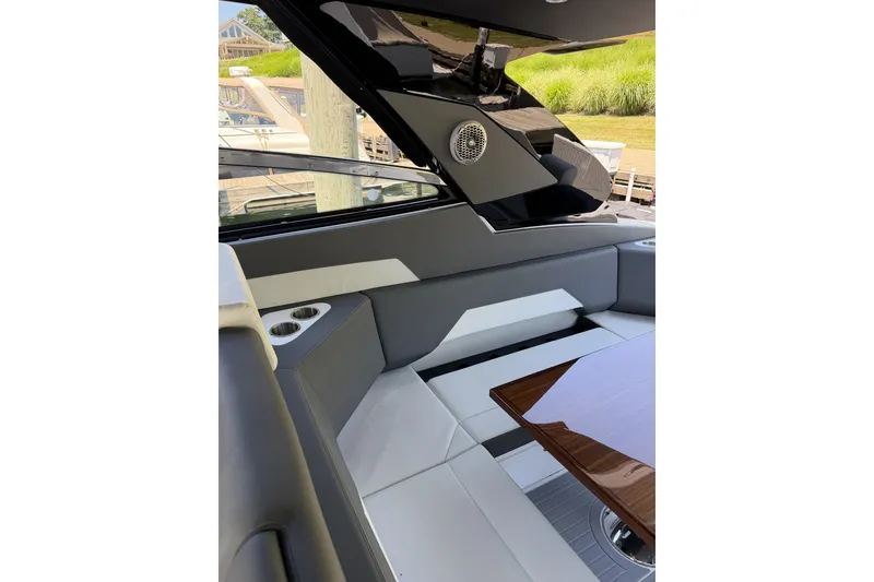 Slide: The Image of Luxurious interior of 2024 Cruisers Yachts 42 GLS OB with sleek seating and table. - 15