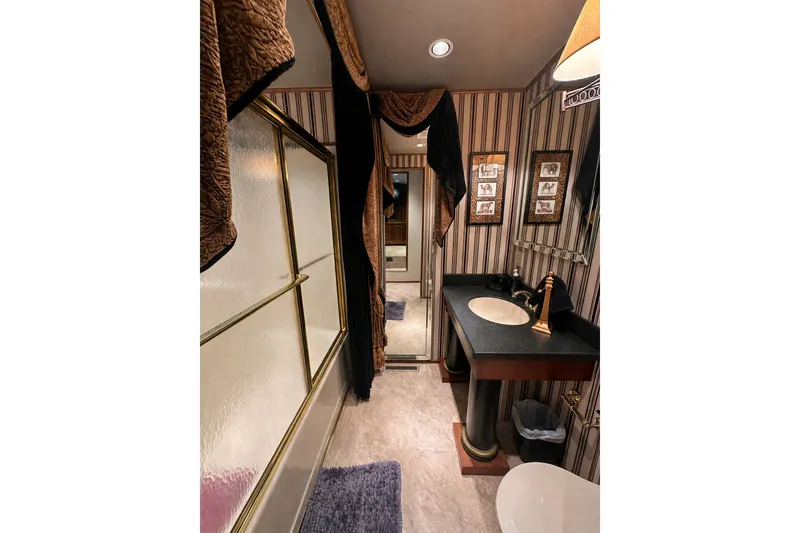 Slide: The Image of Luxurious bathroom in a 1997 Sumerset 16x83 houseboat with elegant decor and modern fixtures. - 8