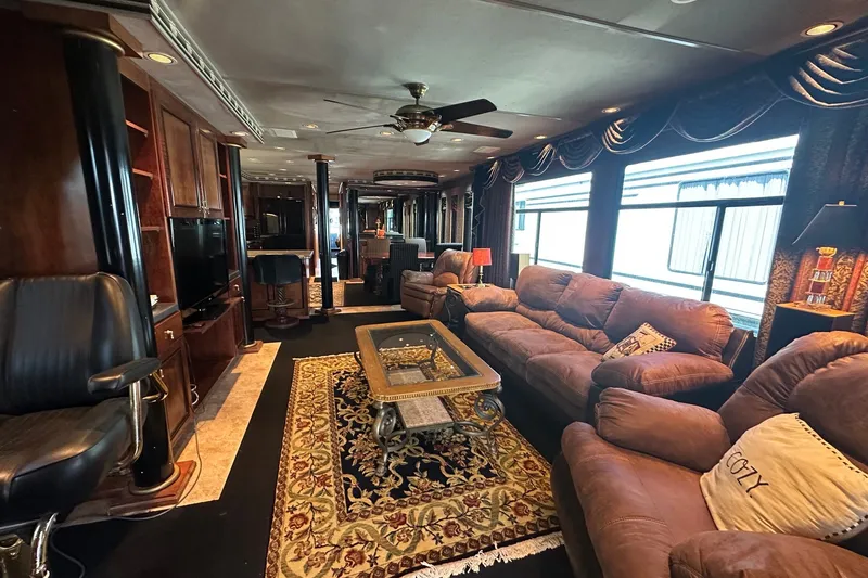 Slide: The Image of Luxurious interior of a 1997 Sumerset 16x83 houseboat with plush seating and elegant decor. - 2