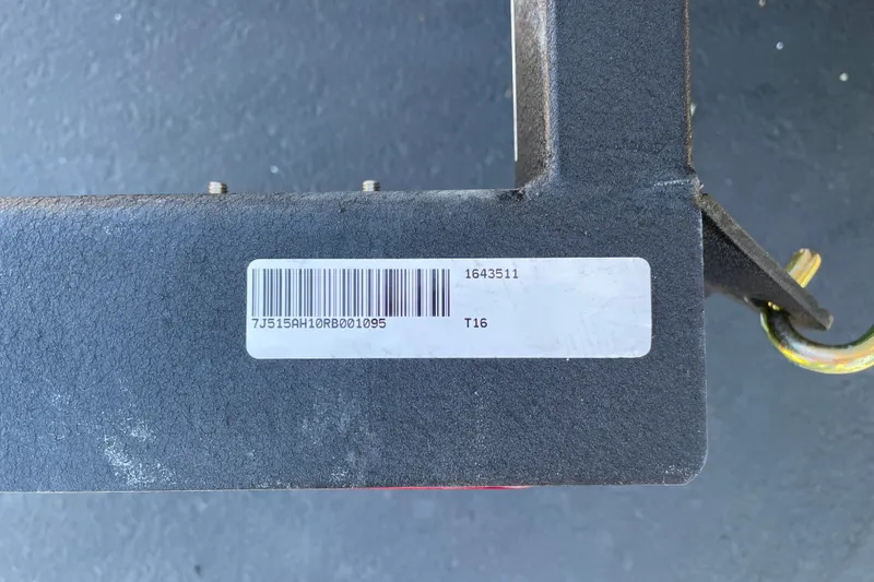 Slide: The Image of Close-up of a 2024 Tahoe T16 component with barcode and serial number. - 76