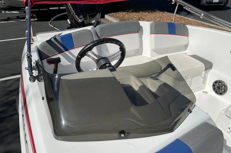Slide: The Image of 2024 Tahoe T16 boat interior with steering wheel and seating, featuring modern design elements. - 10