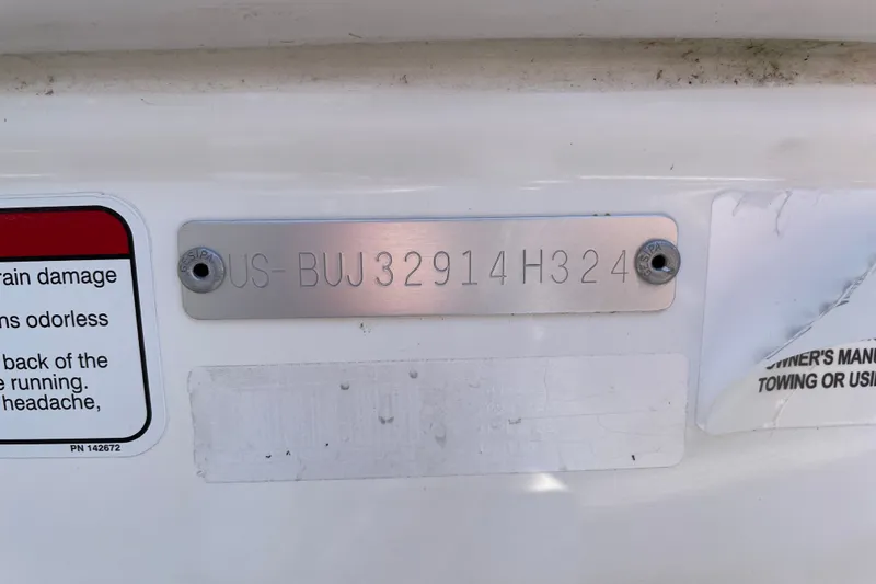 Slide: The Image of 2024 Tahoe T16 identification plate with warning labels and serial number. - 74