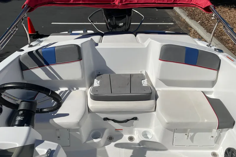 Slide: The Image of 2024 Tahoe T16 boat interior with seating and steering wheel. - 16