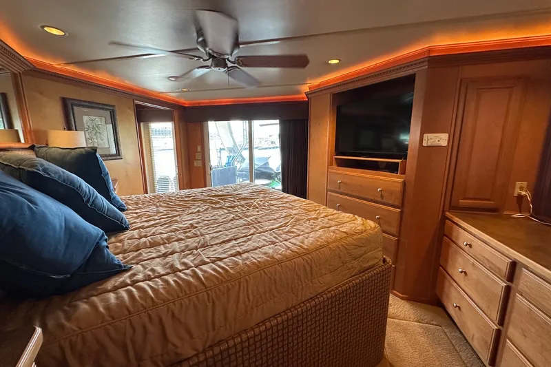 Slide: The Image of Luxurious bedroom interior of 2003 Sumerset 18x86 houseboat with cozy bed and ambient lighting. - 15