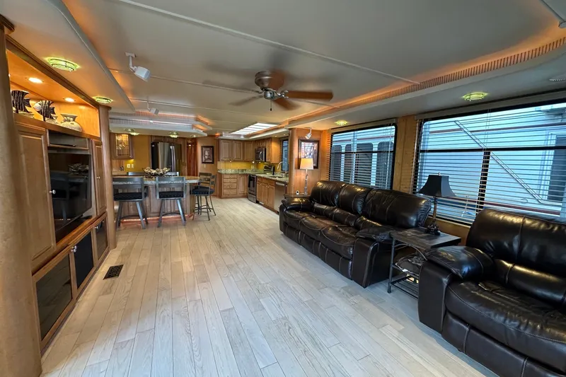 Slide: The Image of Luxurious interior of a 2003 Sumerset 18x86 houseboat with leather seating and modern kitchen. - 2