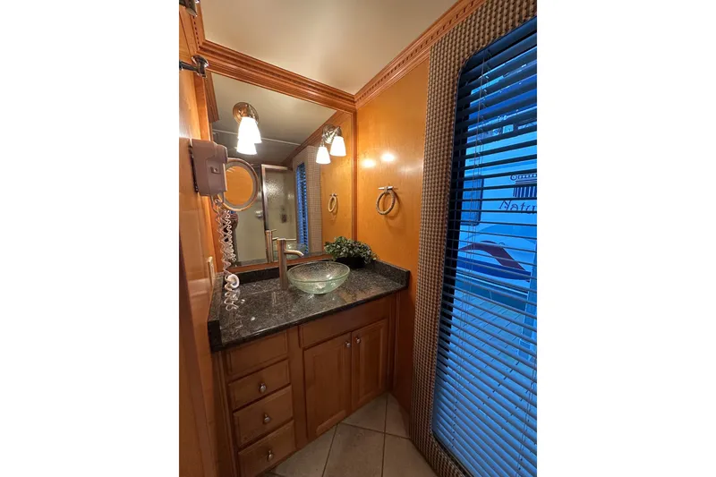Slide: The Image of Luxurious bathroom in 2003 Sumerset 18x86 houseboat with modern fixtures and elegant design. - 13