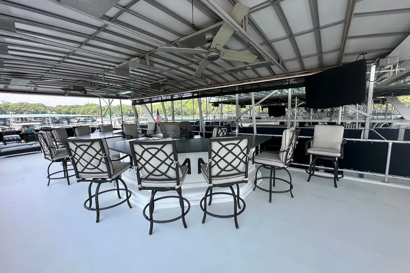 Slide: The Image of Spacious upper deck of 2003 Sumerset 18x86 houseboat with seating and ceiling fan. - 21