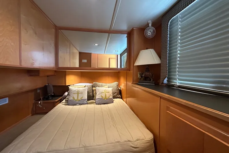 Slide: The Image of Cozy bedroom in 2003 Sumerset 18x86 houseboat with nautical-themed decor. - 10