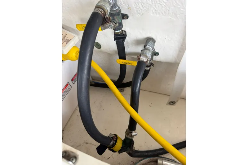 Slide: The Image of Close-up of hoses and valves in a 2004 Sea Ray Sundancer 320 boat. - 50