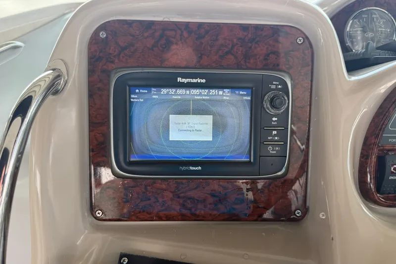 Slide: The Image of Raymarine navigation system on 2004 Sea Ray Sundancer 320 dashboard. - 41