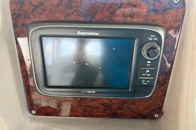 Slide: The Image of Raymarine hybrid touch display on 2004 Sea Ray Sundancer 320 boat dashboard. - 32