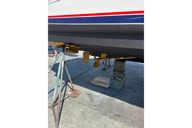 Slide: The Image of 2004 Sea Ray Sundancer 320 boat hull and propeller on dry dock. - 16