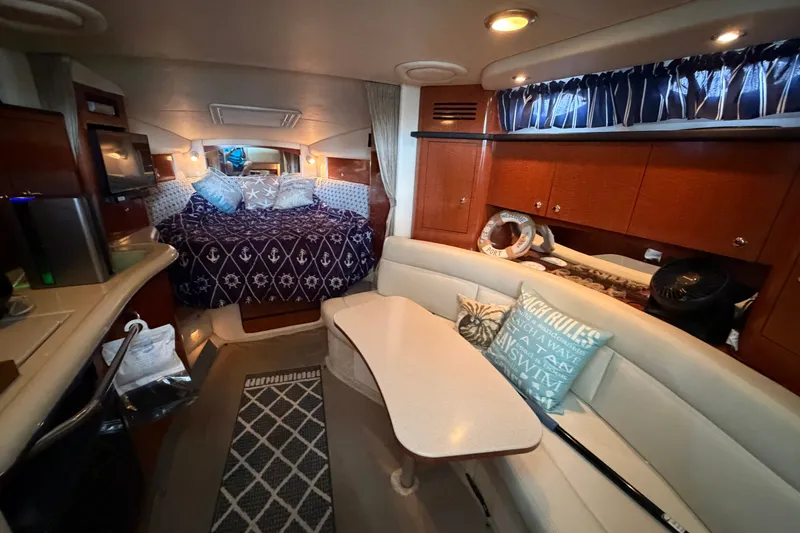 Slide: The Image of Luxurious interior of 2004 Sea Ray Sundancer 320 yacht with cozy seating and elegant decor. - 42