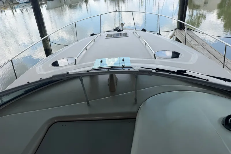Slide: The Image of 2004 Sea Ray Sundancer 320 boat deck view at marina. - 39
