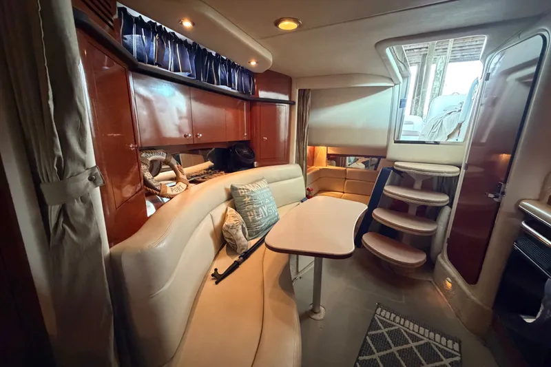 Slide: The Image of Interior of 2004 Sea Ray Sundancer 320 yacht with cozy seating and elegant wood finishes. - 47