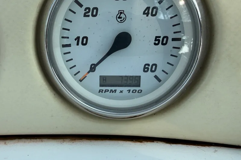 Slide: The Image of Tachometer of 2000 Larson Cabrio 330 showing 739.6 RPM x 100. - 28
