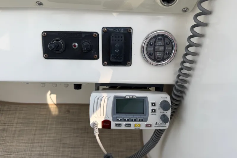 Slide: The Image of Control panel of a 2000 Larson Cabrio 330 boat with GPS and audio system. - 24