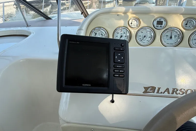 Slide: The Image of Dashboard of a 2000 Larson Cabrio 330 boat with Garmin navigation system. - 26